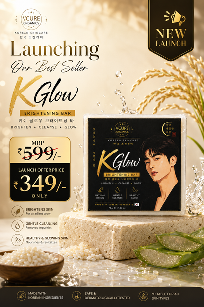 Promotional banner for VCURE Organics K Glow Brightening Bar, showing the product packaging box, launch pricing (₹599/- down to ₹349/-), and marketing text on a warm beige background with skincare props like a sponge, aloe vera, and grains.